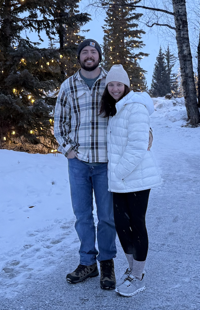 David Sharpe, founder of SharpeMSP, with his wife on a snowy tree-lined path